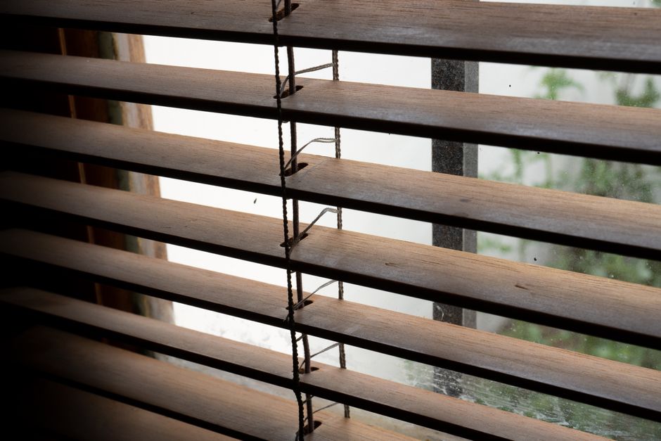 High-quality wooden window blinds in a sunny room