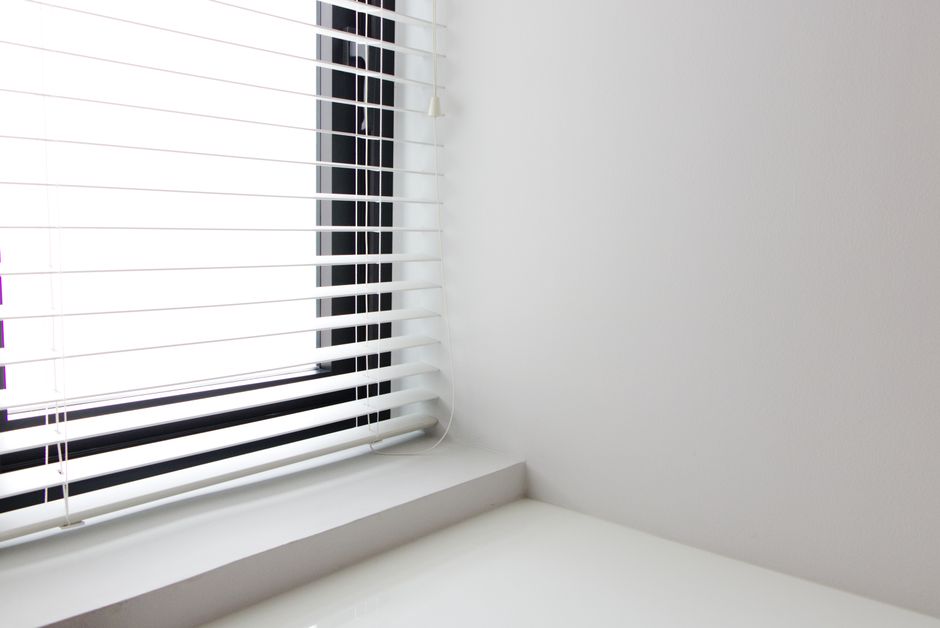 Professional installation of new window blinds